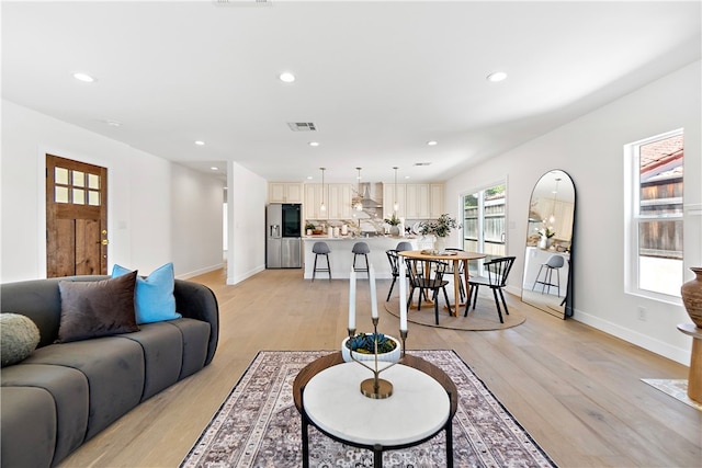 3991 Hubert Ave, Los Angeles, CA 90008 - living room featuring light wood-type flooring, recessed lighting, and baseboards