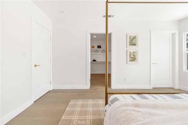 3991 Hubert Ave, Los Angeles, CA 90008 - bedroom with wood finished floors, baseboards, and a spacious closet