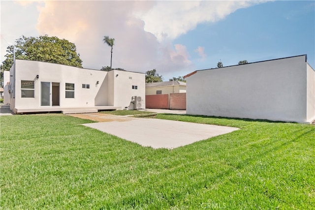 3991 Hubert Ave, Los Angeles, CA 90008 - rear view of house featuring stucco siding and a patio area