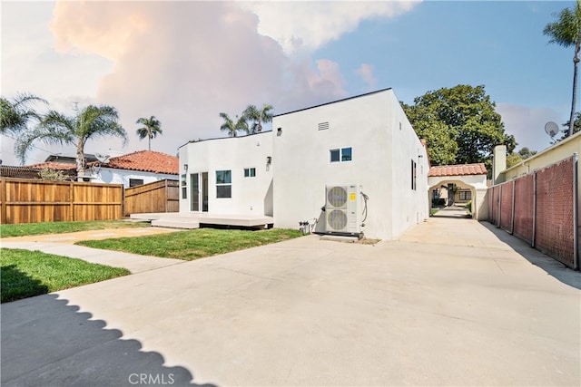 3991 Hubert Ave, Los Angeles, CA 90008 - rear view of property with ac unit, stucco siding, and a patio