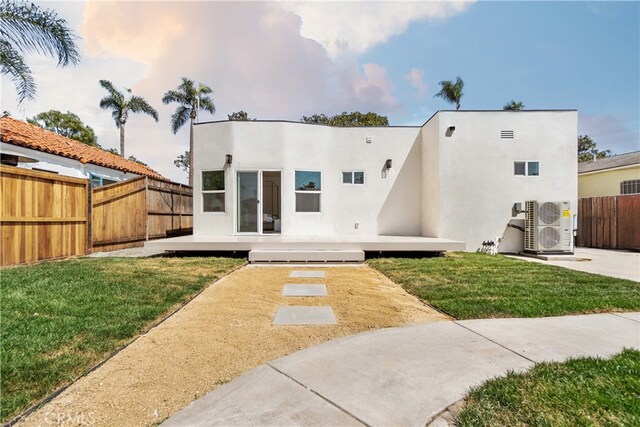 3991 Hubert Ave, Los Angeles, CA 90008 - rear view of property featuring stucco siding, a wooden deck, and a cooling unit