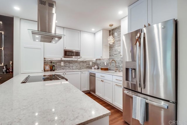 6780 Friars Rd Unit 264, San Diego, CA 92108 - kitchen featuring stainless steel appliances, island exhaust hood, tasteful backsplash, white cabinetry, and recessed lighting