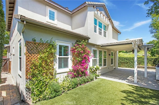 25 Bellflower St, Ladera Ranch, CA 92694 - back of house featuring stucco siding, a patio area, and a pergola