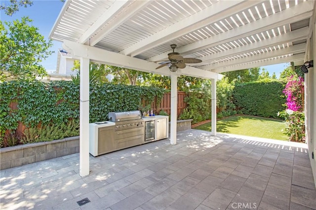 25 Bellflower St, Ladera Ranch, CA 92694 - fenced backyard with ceiling fan, exterior kitchen, a patio, and a pergola