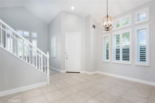 25 Bellflower St, Ladera Ranch, CA 92694 - tiled foyer entrance featuring a chandelier, stairs, and high vaulted ceiling