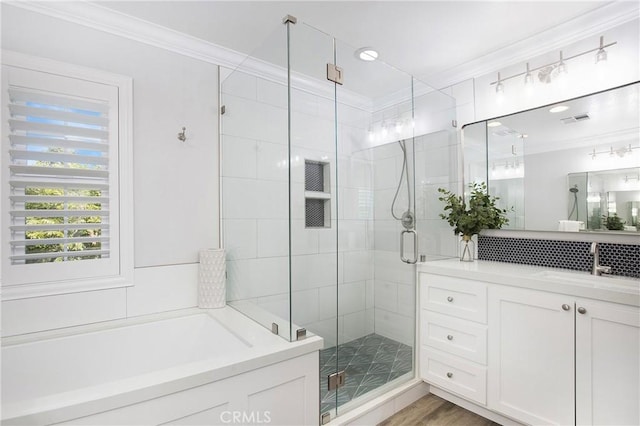 25 Bellflower St, Ladera Ranch, CA 92694 - bathroom featuring crown molding, vanity, a stall shower, and a garden tub