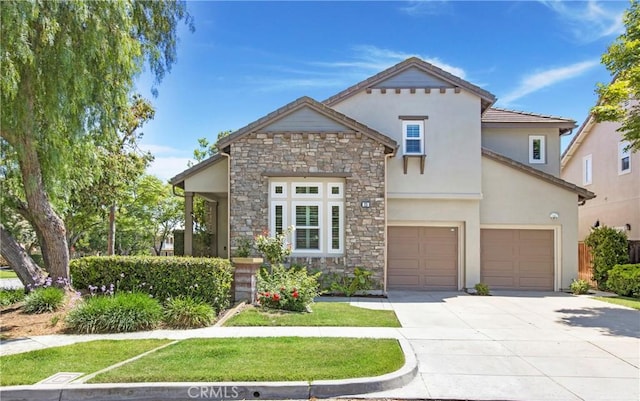 25 Bellflower St, Ladera Ranch, CA 92694 - view of front of property featuring stone siding, driveway, stucco siding, and a garage