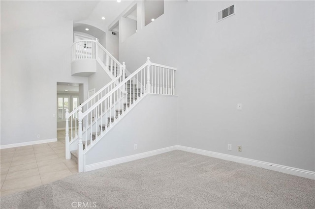 25 Bellflower St, Ladera Ranch, CA 92694 - stairs with recessed lighting, a high ceiling, carpet, and tile patterned flooring