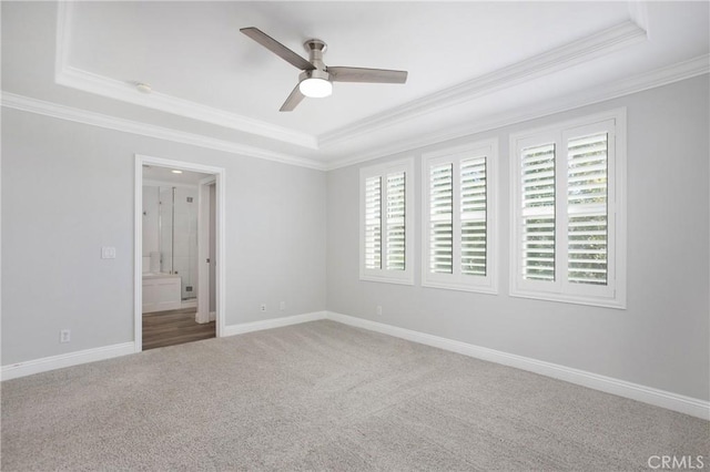 25 Bellflower St, Ladera Ranch, CA 92694 - spare room featuring a raised ceiling, crown molding, healthy amount of natural light, ceiling fan, and carpet floors