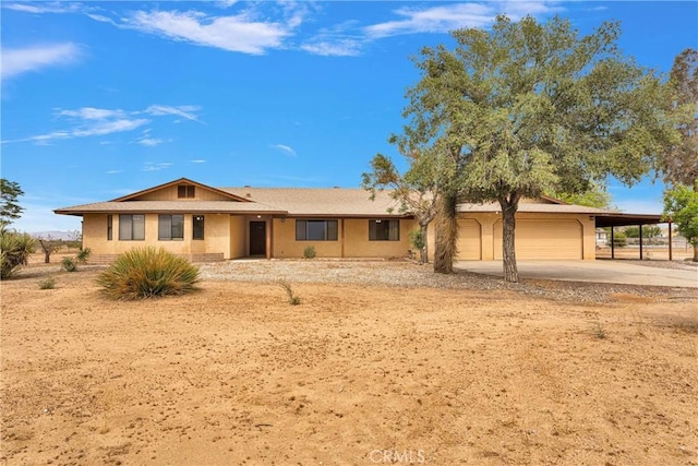 21978 Mojave St, Apple Valley, CA 92308 - ranch-style home with concrete driveway, a garage, and an attached carport