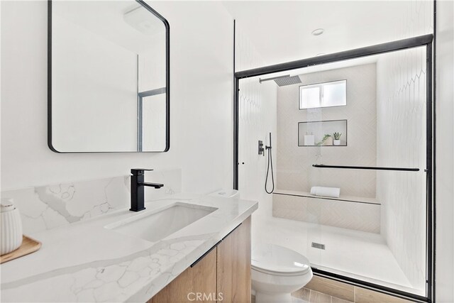 3927 Welland Ave, Los Angeles, CA 90008 - bathroom featuring vanity, toilet, and a shower stall