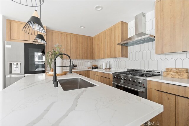 3927 Welland Ave, Los Angeles, CA 90008 - kitchen with wall chimney range hood, stainless steel appliances, a sink, and modern cabinets