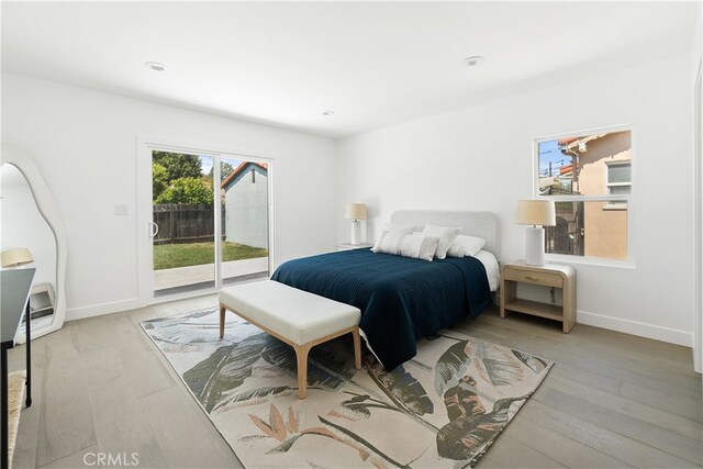 3927 Welland Ave, Los Angeles, CA 90008 - bedroom with access to outside, wood finished floors, baseboards, and recessed lighting