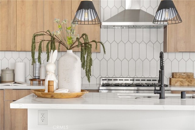 3927 Welland Ave, Los Angeles, CA 90008 - kitchen view of decorative backsplash, brown cabinets, wall chimney range hood, modern cabinets, and pendant lighting