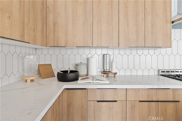 3927 Welland Ave, Los Angeles, CA 90008 - kitchen with modern cabinets, light brown cabinetry, and decorative backsplash