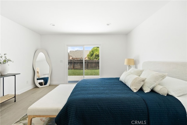 3927 Welland Ave, Los Angeles, CA 90008 - bedroom featuring access to exterior, light wood-type flooring, and baseboards