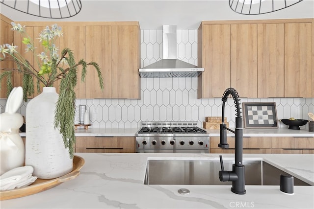 3927 Welland Ave, Los Angeles, CA 90008 - kitchen with wall chimney exhaust hood, a sink, modern cabinets, and stainless steel gas stove