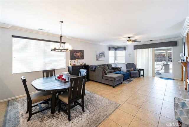 29183 Paperflower Ln, Menifee, CA 92584 - dining space with a chandelier, crown molding, light tile patterned floors, ceiling fan, and baseboards