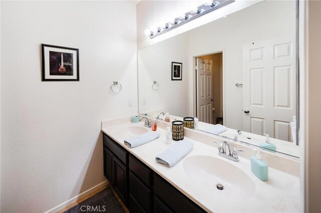 29183 Paperflower Ln, Menifee, CA 92584 - bathroom with double vanity and baseboards