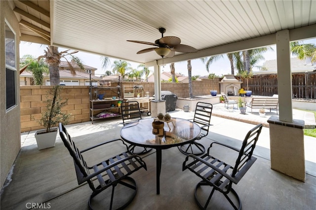 29183 Paperflower Ln, Menifee, CA 92584 - fenced backyard with an outdoor fireplace, a patio area, ceiling fan, and outdoor dining space