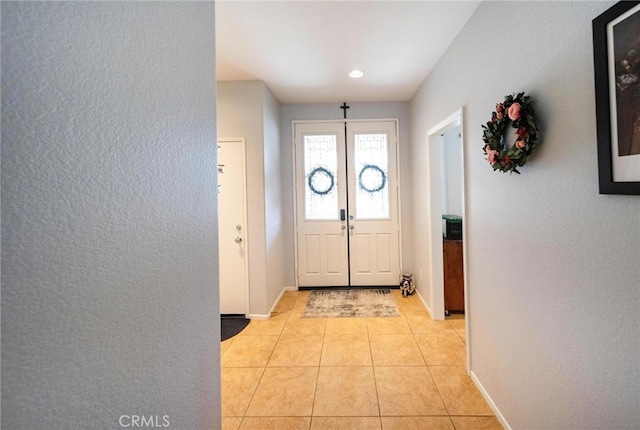 29183 Paperflower Ln, Menifee, CA 92584 - foyer entrance with a textured wall, baseboards, and light tile patterned floors