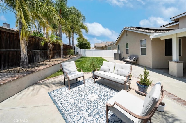 29183 Paperflower Ln, Menifee, CA 92584 - fenced backyard with an outdoor living space, a patio area, and central AC
