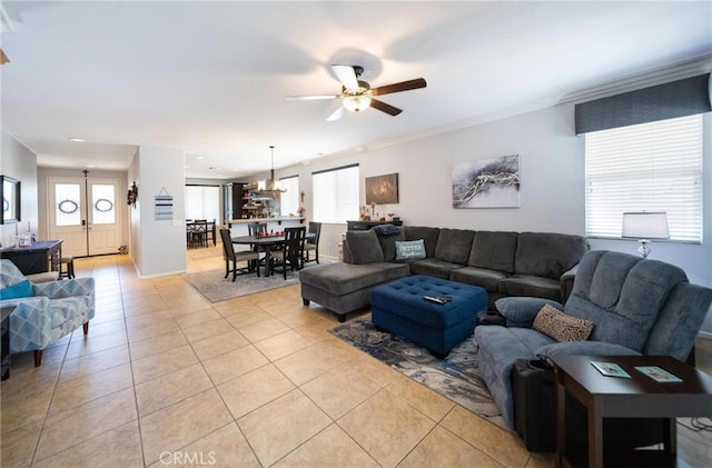 29183 Paperflower Ln, Menifee, CA 92584 - living room with ceiling fan, light tile patterned flooring, healthy amount of natural light, and ornamental molding