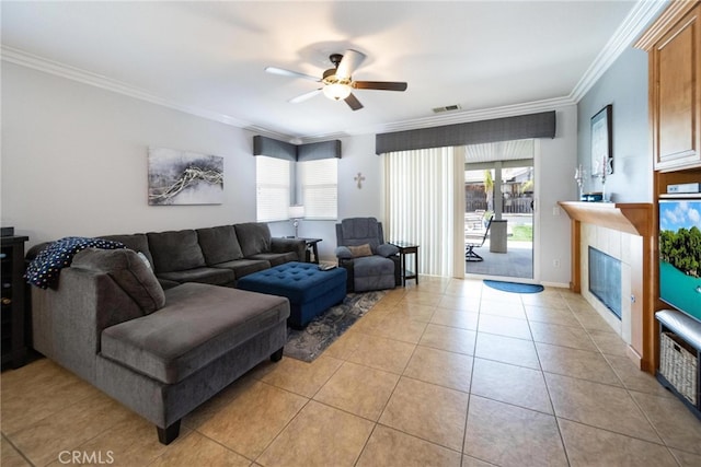 29183 Paperflower Ln, Menifee, CA 92584 - living room with ornamental molding, a ceiling fan, healthy amount of natural light, light tile patterned floors, and a tile fireplace