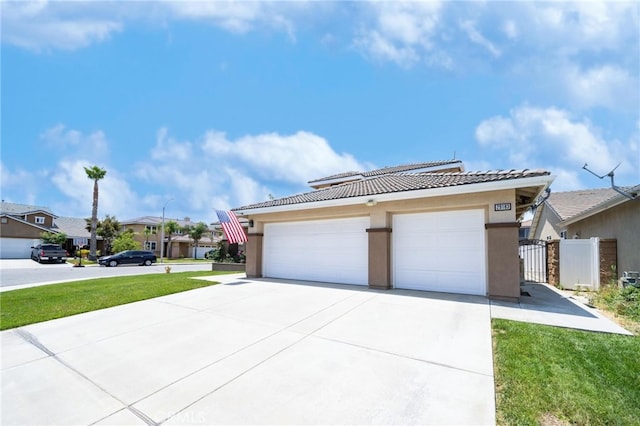 29183 Paperflower Ln, Menifee, CA 92584 - view of front of property featuring a tile roof, stucco siding, a garage, concrete driveway, and a residential view