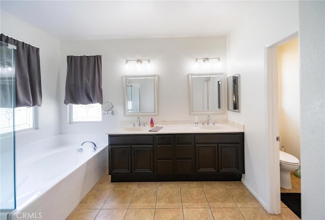 29183 Paperflower Ln, Menifee, CA 92584 - bathroom featuring double vanity, tile patterned flooring, a bath, and toilet