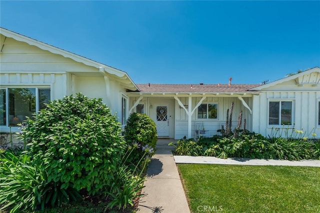 2116 E Thackery St, West Covina, CA 91791 - doorway to property with board and batten siding and roof with shingles