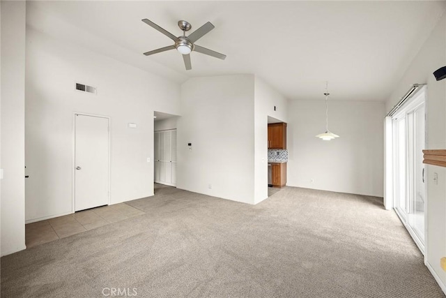 549 Springbrook N, Irvine, CA 92614 - unfurnished living room featuring light colored carpet, vaulted ceiling, and ceiling fan