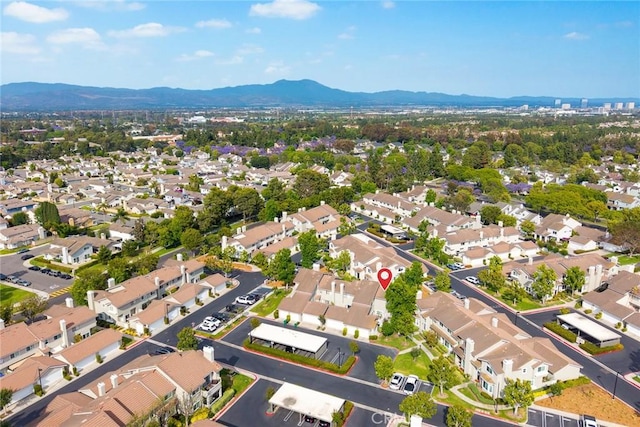 549 Springbrook N, Irvine, CA 92614 - aerial overview of property's location with a mountainous background and nearby suburban area