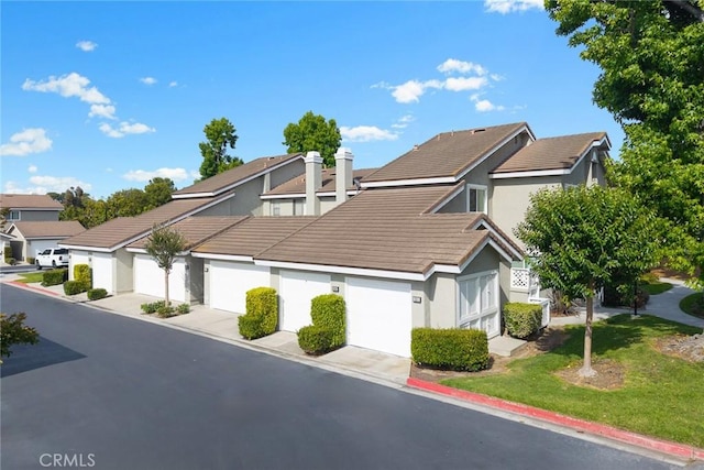 549 Springbrook N, Irvine, CA 92614 - view of front of house with a tile roof, stucco siding, a front lawn, and a residential view