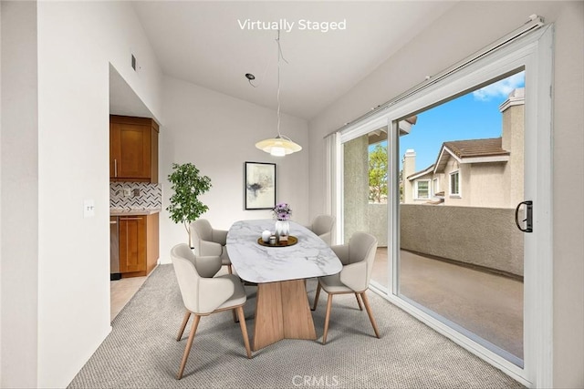 549 Springbrook N, Irvine, CA 92614 - dining room with light carpet and lofted ceiling