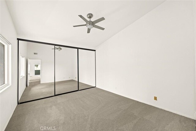 549 Springbrook N, Irvine, CA 92614 - unfurnished bedroom with carpet flooring, lofted ceiling, a closet, and a ceiling fan