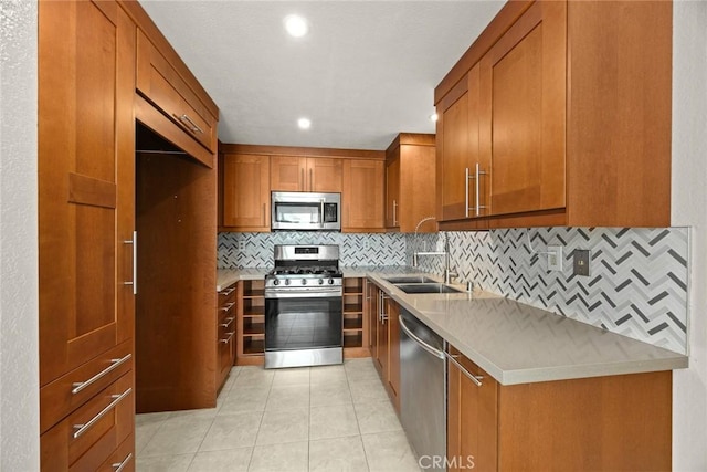 549 Springbrook N, Irvine, CA 92614 - kitchen with appliances with stainless steel finishes, a sink, brown cabinetry, backsplash, and light countertops
