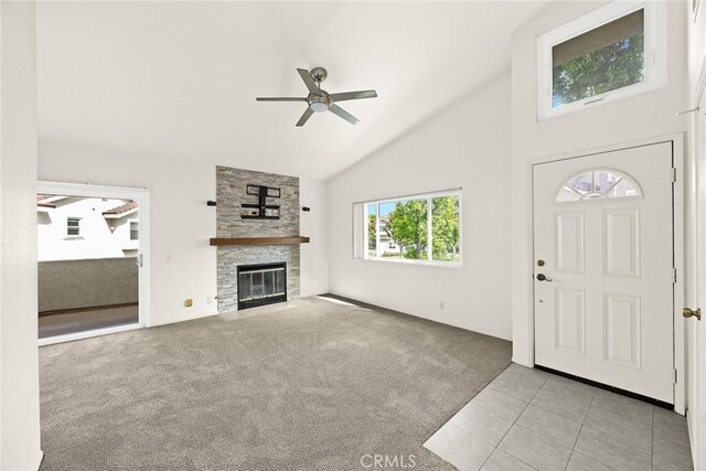 549 Springbrook N, Irvine, CA 92614 - tiled foyer entrance featuring ceiling fan, carpet floors, a fireplace, and high vaulted ceiling