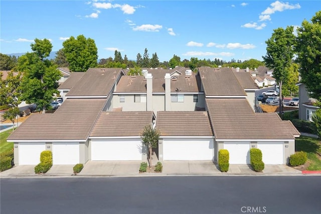 549 Springbrook N, Irvine, CA 92614 - view of front of house featuring a residential view, a tile roof, and stucco siding