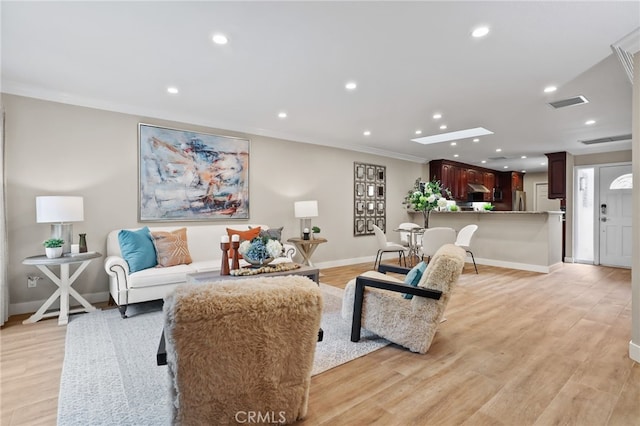 77 Seton Rd, Irvine, CA 92612 - living area with crown molding, recessed lighting, baseboards, and light wood-style flooring
