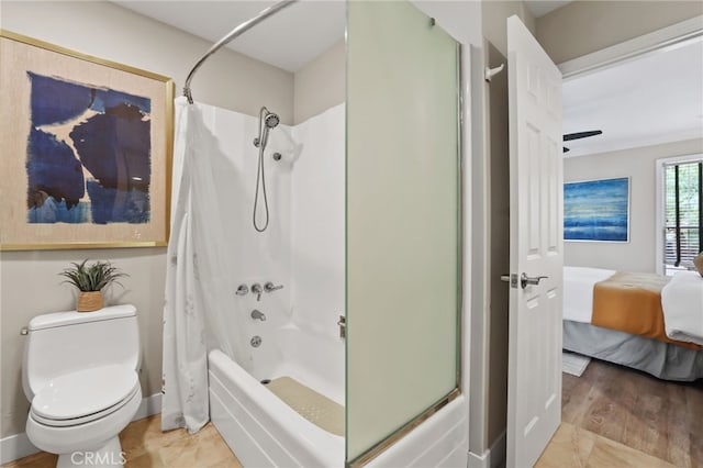 77 Seton Rd, Irvine, CA 92612 - full bathroom with ensuite bath, shower / bath combo with shower curtain, toilet, wood finished floors, and baseboards