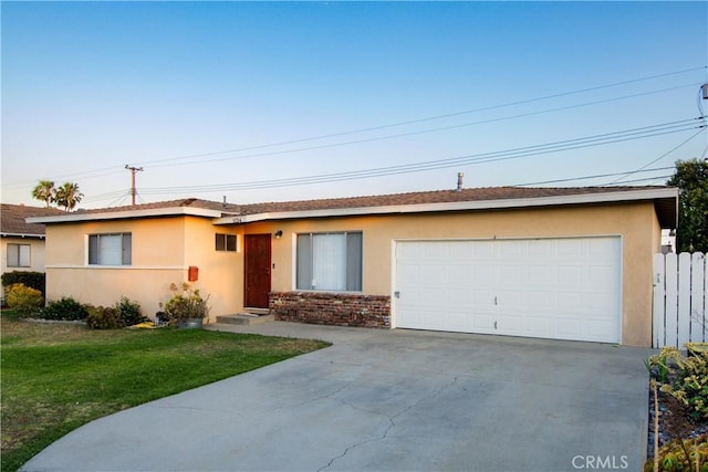 1134 E Highland Ct, Ontario, CA 91764 - ranch-style house with stucco siding, driveway, and a front yard