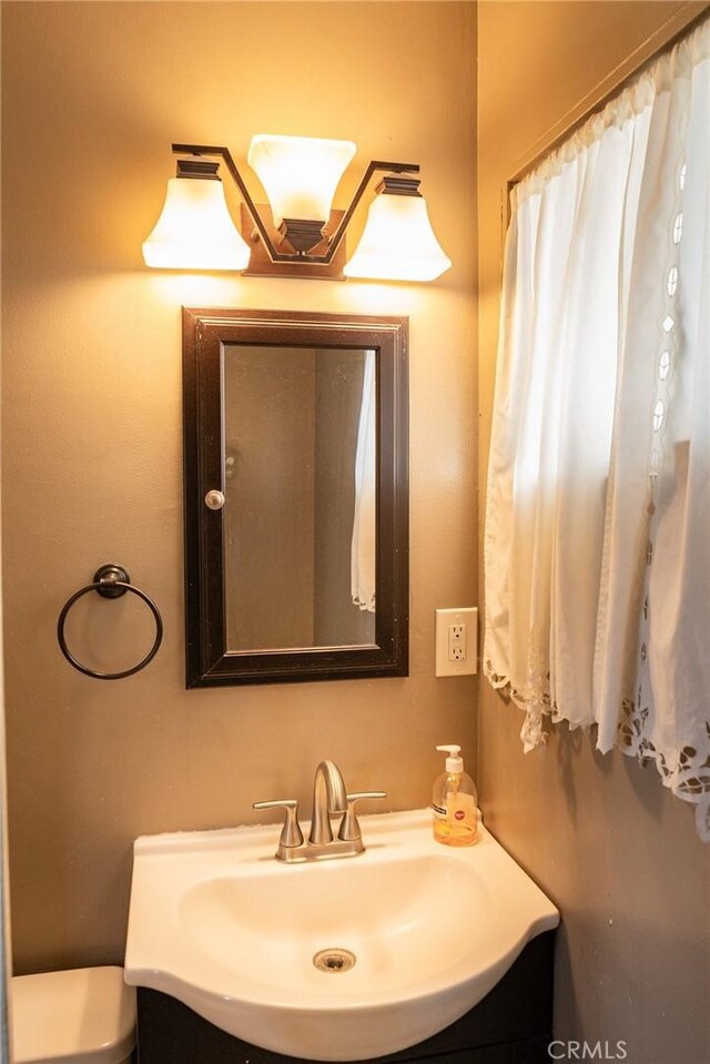 1134 E Highland Ct, Ontario, CA 91764 - bathroom with vanity and toilet