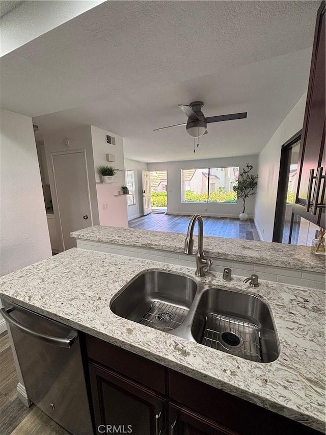 113 Pearl Unit 106, Laguna Niguel, CA 92677 - kitchen featuring a sink, wood finished floors, dishwasher, light stone counters, and a ceiling fan