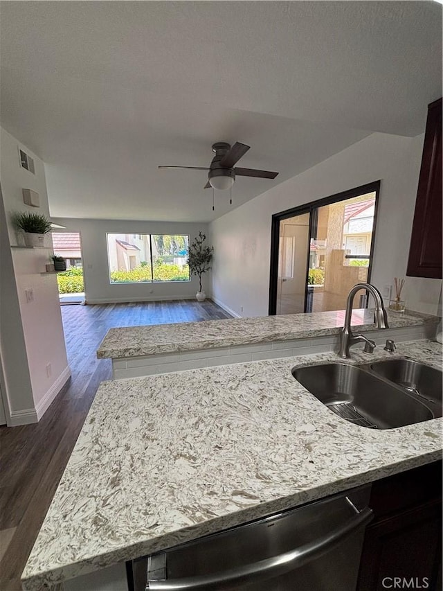 113 Pearl Unit 106, Laguna Niguel, CA 92677 - kitchen with a sink, light stone counters, dark wood finished floors, ceiling fan, and dishwasher