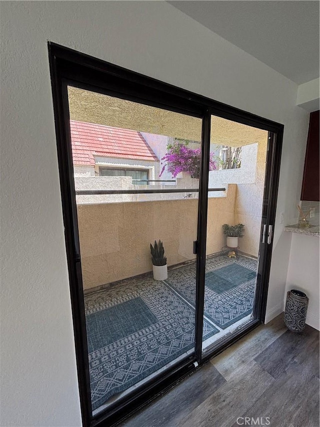 113 Pearl Unit 106, Laguna Niguel, CA 92677 - doorway to outside featuring wood finished floors