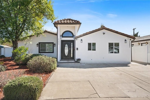 23800 Mobile St, West Hills, CA 91307 - mediterranean / spanish-style house featuring a tile roof and stucco siding