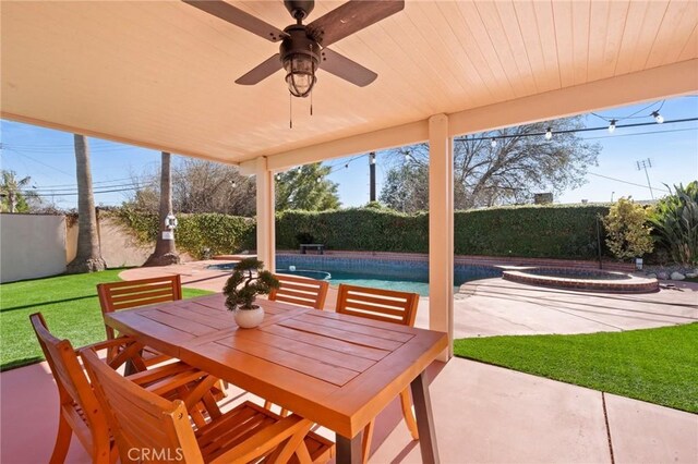23800 Mobile St, West Hills, CA 91307 - fenced backyard featuring an in-ground hot tub, a patio area, ceiling fan, and outdoor dining area