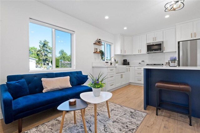 23800 Mobile St, West Hills, CA 91307 - living area with light wood finished floors and recessed lighting