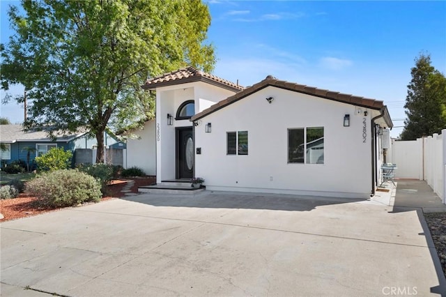 23800 Mobile St, West Hills, CA 91307 - mediterranean / spanish house with a tile roof, stucco siding, and a patio